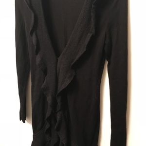 Black sweater with clip closure. Never worn.